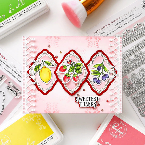 Card with 'Sweetest Thanks' design featuring fruits and berries, surrounded by stamping tools on a white surface.