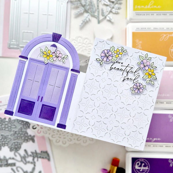 Greeting card with purple door illustration and floral text on a decorative background