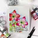 Colorful floral card with 'Just for You' text, surrounded by stamping supplies on a white background