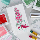 Card with floral design and 'grateful forever' text, surrounded by stamping supplies on a light background.