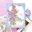 Card with floral design and 'Happy Birthday' text on a pink background