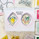 Card with decorative elements and 'Sweetest Thanks' text on a textured surface.
