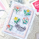 Card with floral design and 'Thanks for showing up with heart' text on a textured surface.
