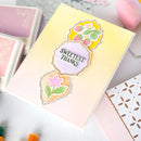 Notebook with floral stickers and 'Sweetest Thanks' text on a light background