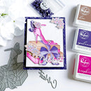 Card with high-heeled shoe design, ink pads, and stamp set on a white background