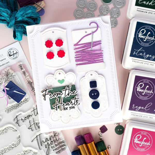 Stamp set with 'From the Heart, for you' text and various stamping supplies on a pink background