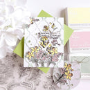 Card with floral design and 'Just a little sunshine for today' text, surrounded by craft supplies.