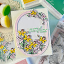 Card with floral design and 'Just a little sunshine for today' text, surrounded by stamping supplies.