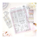 Clear stamp set with building and script designs on a white background