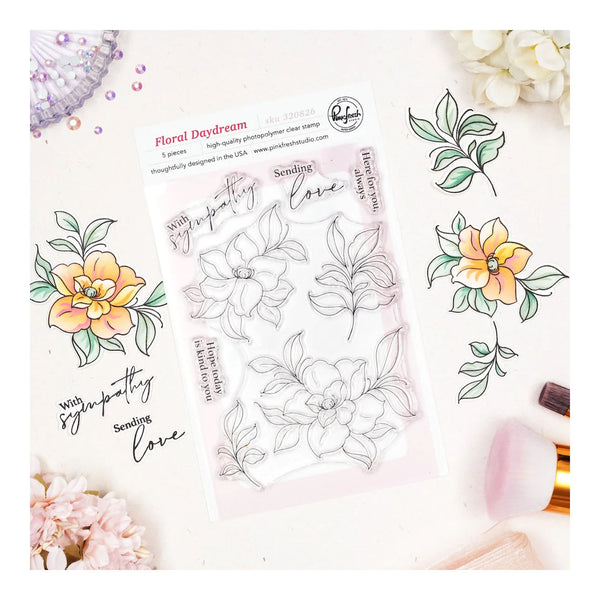 Clear stamp set with floral and leaf designs on a white background
