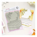 Rubber stamp set of a chair with floral design on a white background