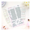 Set of die-cut building shapes on a pink card with floral decorations.