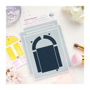 Arch-shaped stencils on a white surface with floral and cosmetic items.