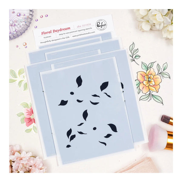 Set of floral stencils on a decorative background with flowers and packaging.
