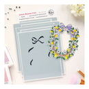 Set of stencils with decorative designs on a light background
