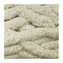 Close-up of textured beige fabric with a knitted pattern