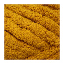 Close-up of a textured mustard yellow fabric