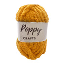 Mustard yellow yarn ball with 'Poppy Crafts' label on a white background