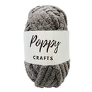 Ball of gray yarn with a 'Poppy Crafts' label on a white background