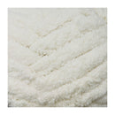 Close-up of a textured white fabric with a diamond pattern