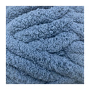 Close-up of blue textured yarn on a white background