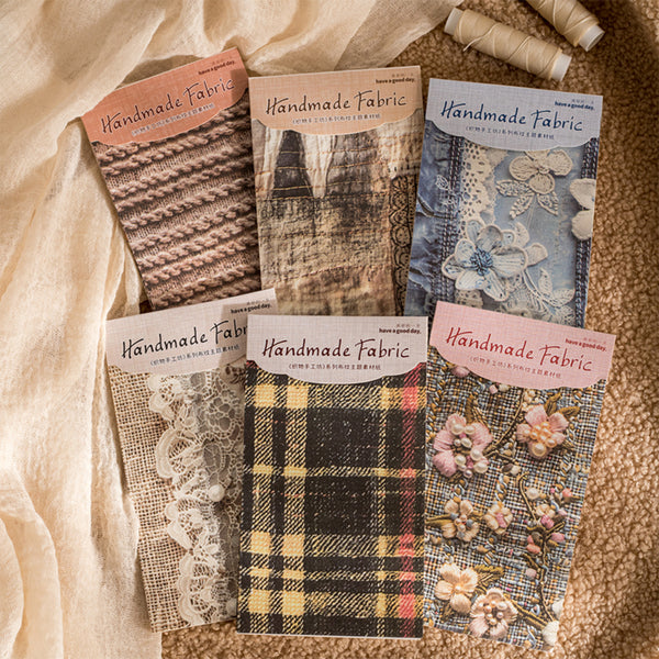 Collection of handmade fabric samples with packaging on a textured surface