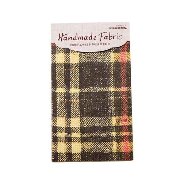 Plaid fabric sample with 'Handmade Fabric' label on a white background