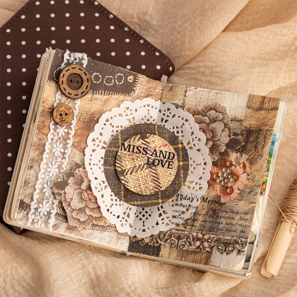 Decorative journal with floral and lace embellishments on a textured surface