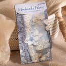 Packaged handmade fabric with floral designs on a beige background