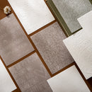Collection of embossed cards with various text designs on a flat surface.