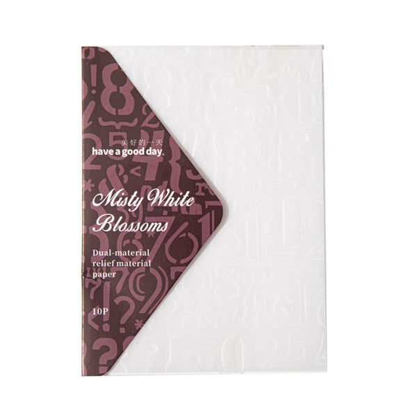 Packaging of Misty White Blossoms paper with a brown patterned flap on a white background