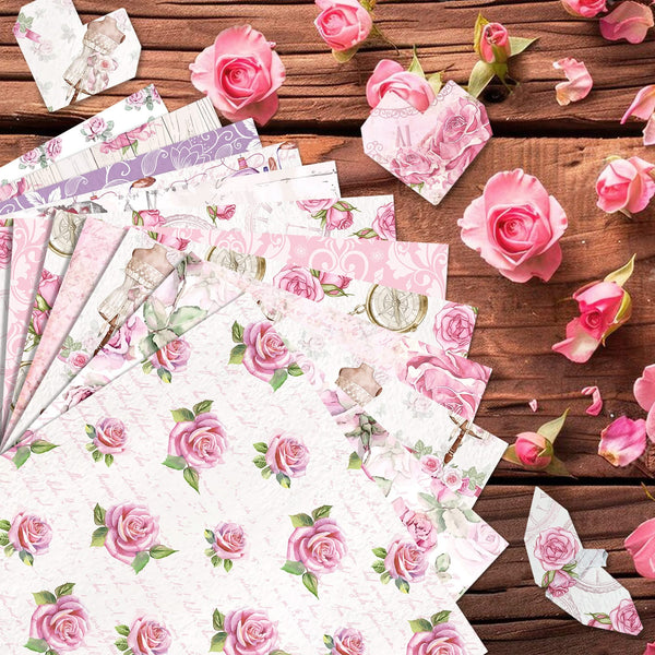 Floral paper sheets with pink roses on a wooden surface