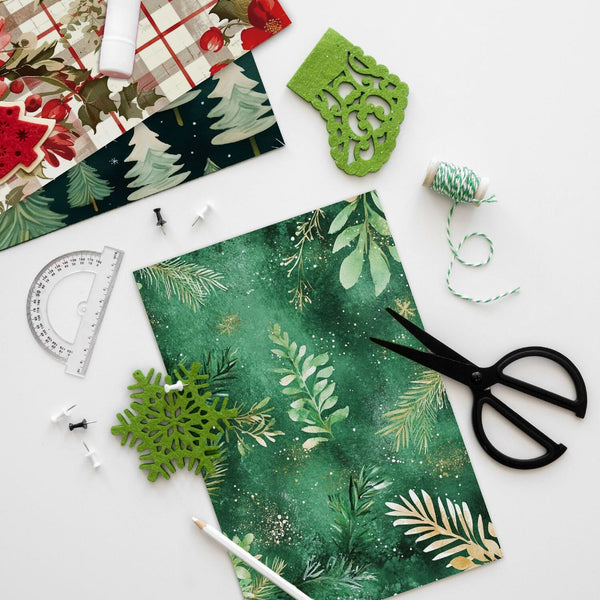 Green floral paper with scissors, ruler, and decorative elements on a white background