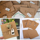 Collage of brown paper packages with tags and necklaces on cards.