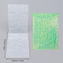 Two textured paper sheets with measurements on a gray background