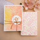 Two patterned cards with decorative elements on a beige background