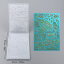 Two sheets of embossed paper with floral designs on a gray background