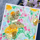 Card with floral design and gold butterfly decorations, surrounded by flowers.