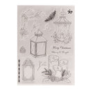 Clear stamp set with Christmas-themed designs including lanterns, candles, and foliage on a white background.