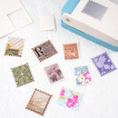 Decorative stamps with floral and vintage designs on a white surface.
