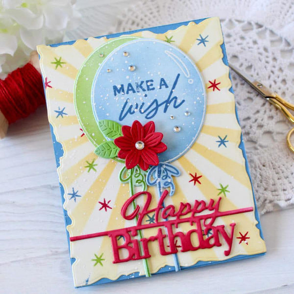 Colorful birthday card with decorative elements on a textured surface