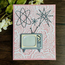 Card with retro television design on a pink patterned background