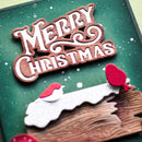 Decorative Christmas card with 'Merry Christmas' text and Santa hats on a green background.