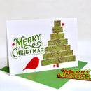 Christmas card with a tree design, red bird, and 'Merry Christmas' text on a white background.