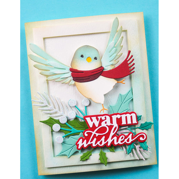 Greeting card with a bird wearing a red scarf and 'warm wishes' text on a blue background