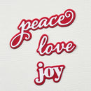 Red and white 'peace love joy' text patches on a textured white background