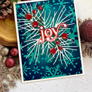 Christmas card with 'joy' text surrounded by holly leaves and berries on a blue background.