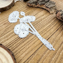 Decorative metal bookmark on a wooden surface