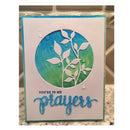 Card with blue and green design and 'You're in my prayers' text on a marble surface