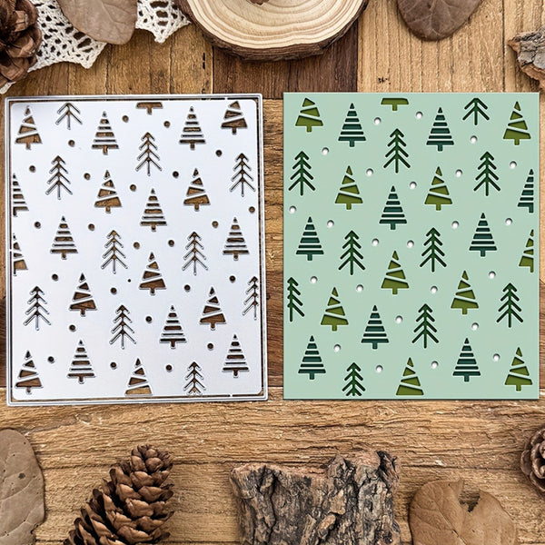 Two stencils with tree patterns on a wooden surface with natural elements.